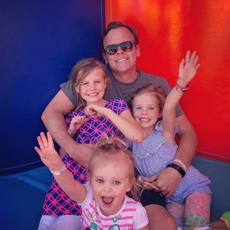Joshua Dobson and his three daughters